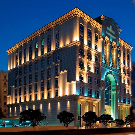 Warwick Doha Hotel Exterior photo The hotel at night