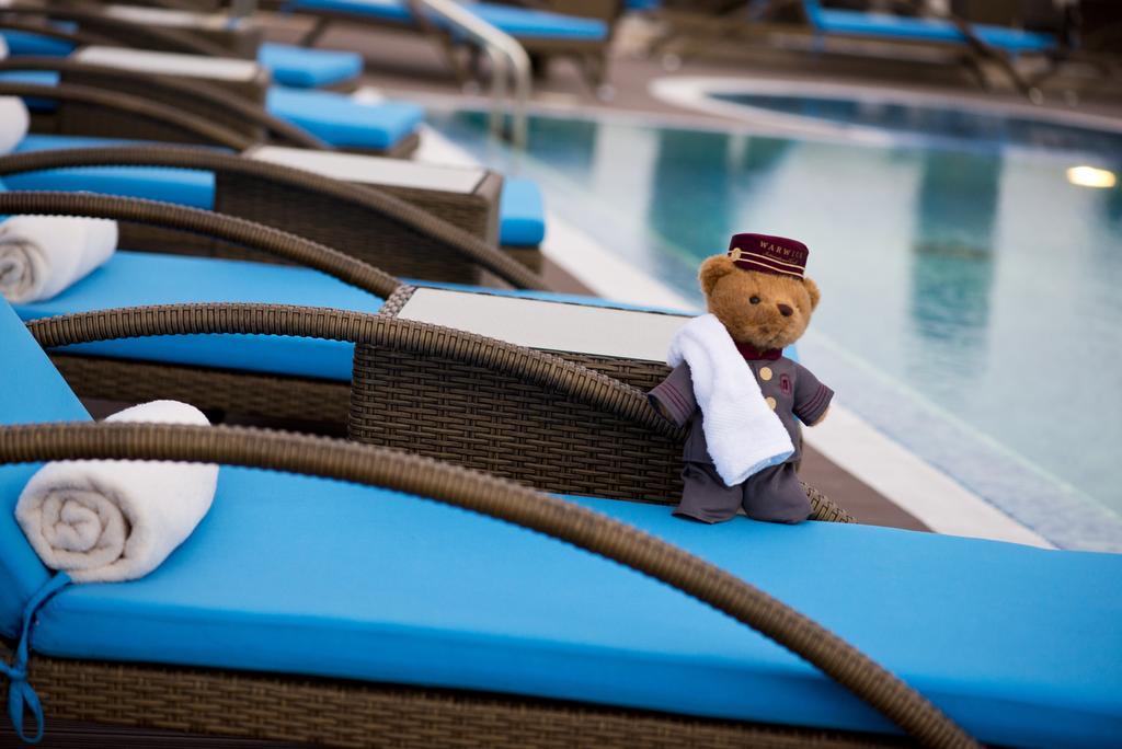 Warwick Doha Hotel Exterior photo The Bear at the pool
