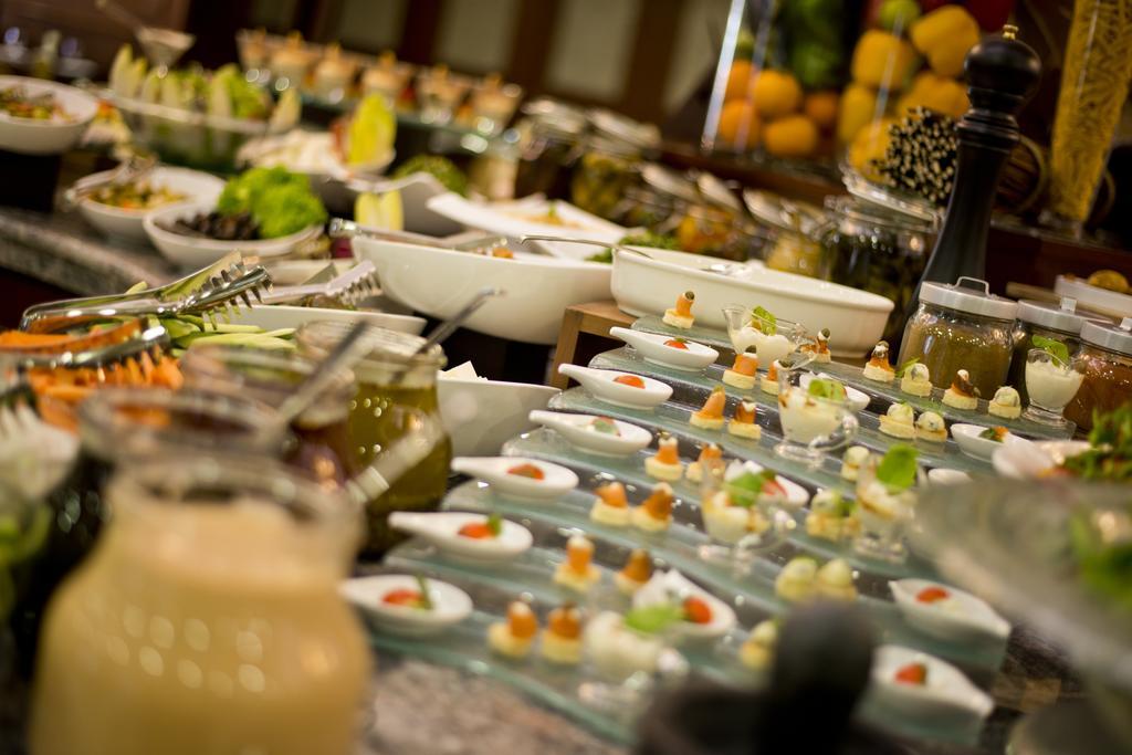 Warwick Doha Hotel Exterior photo A buffet at a hotel