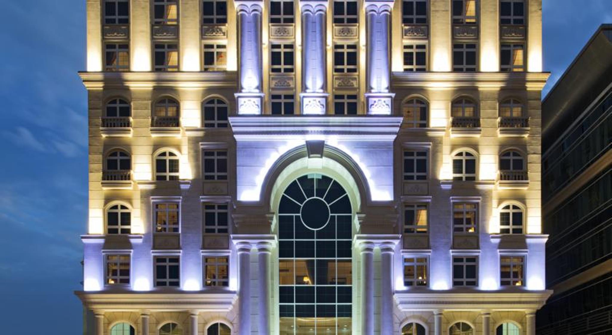 Warwick Doha Hotel Exterior photo The hotel at night