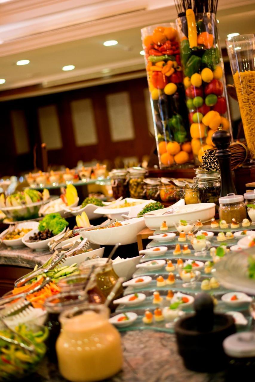 Warwick Doha Hotel Exterior photo A buffet at a hotel