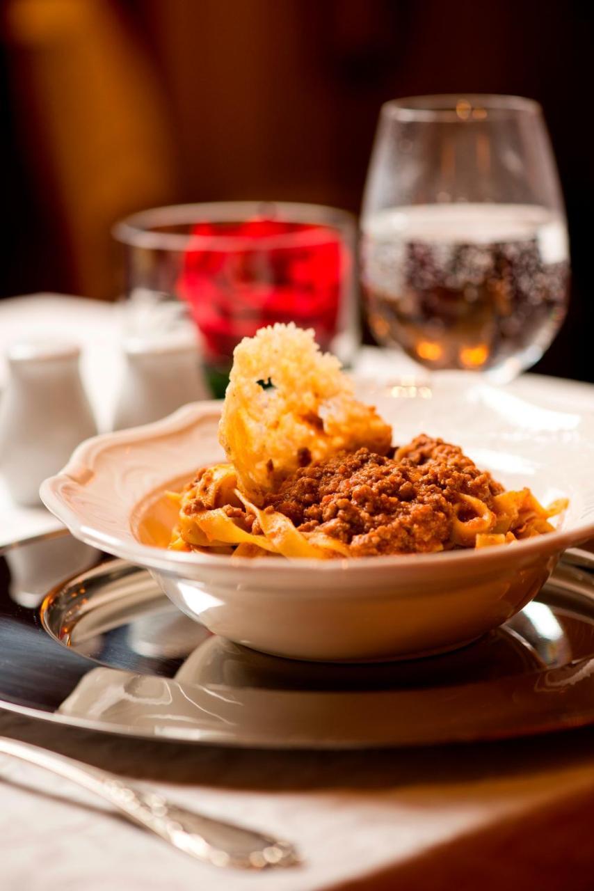Warwick Doha Hotel Exterior photo A plate of Bolognese