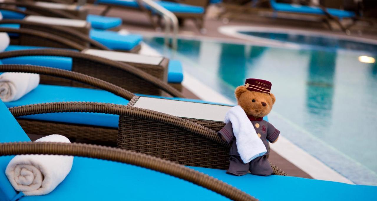 Warwick Doha Hotel Exterior photo The hotel's mascot, the "Concierge Bear"